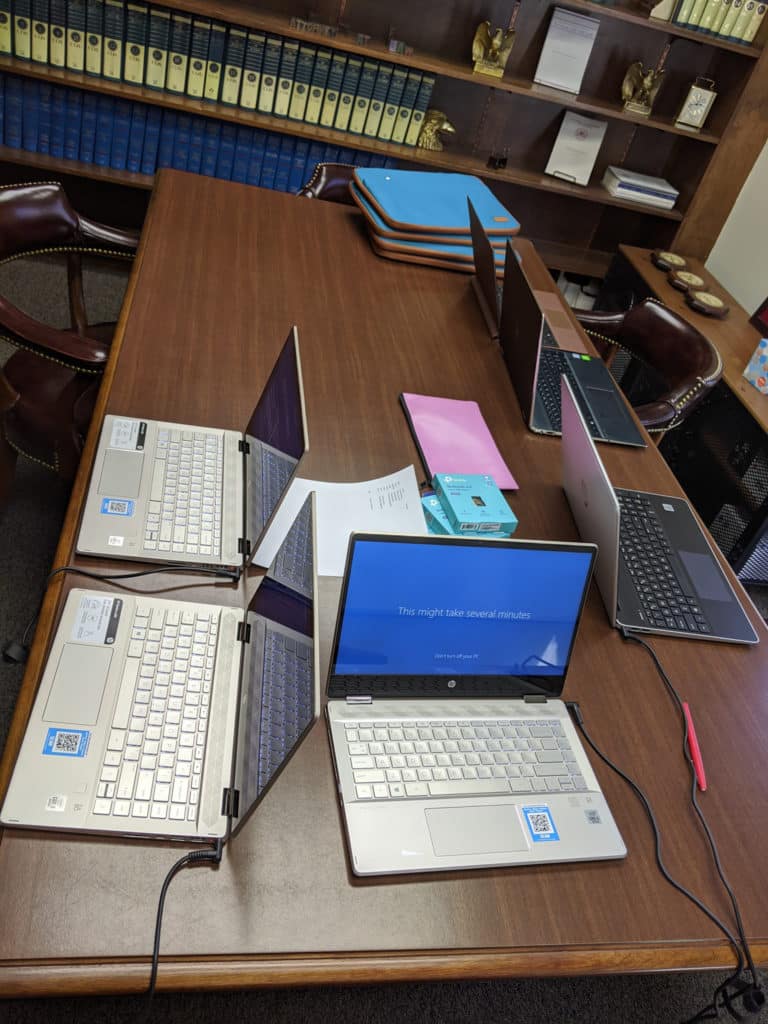 photo of laptops being set up
