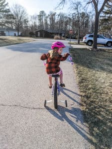 photo of child taking bike ride