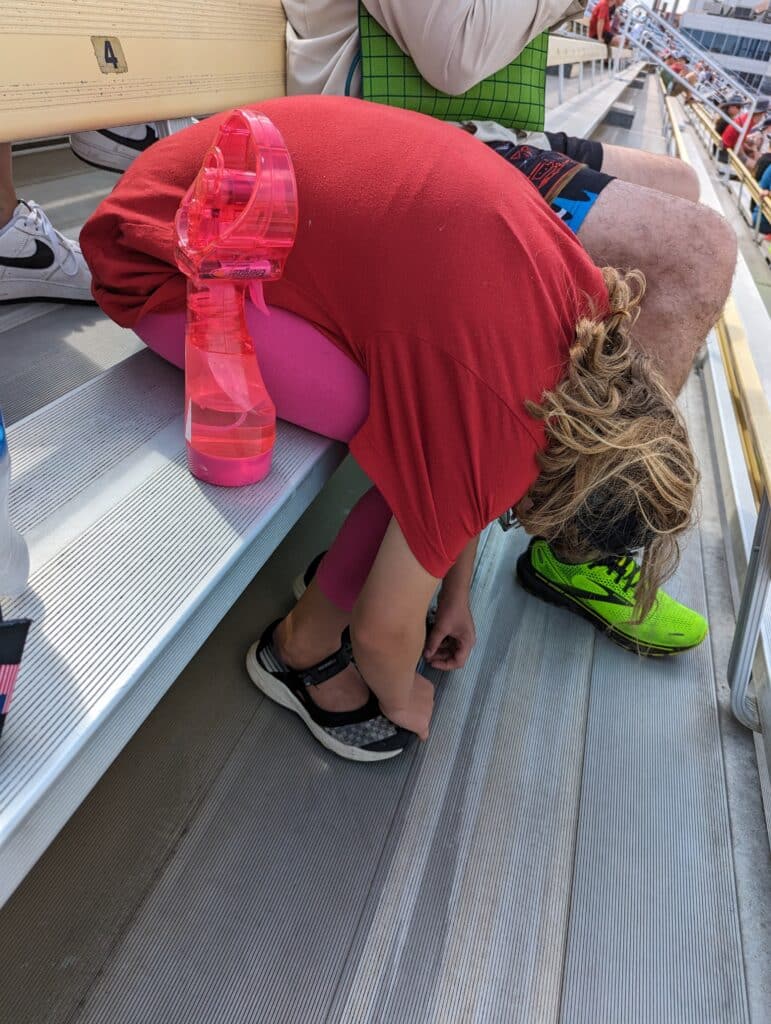 photo of kid slumped over in seat at Iowa Speedway
